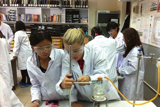 Yada and Megan work together during Chemistry lab
