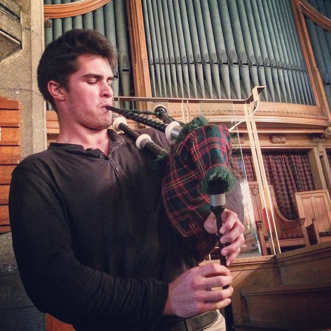 Jonah learns to play the bagpipes in Scotland, taught by students of the Merchiston Castle School. Photo by Tiana S.