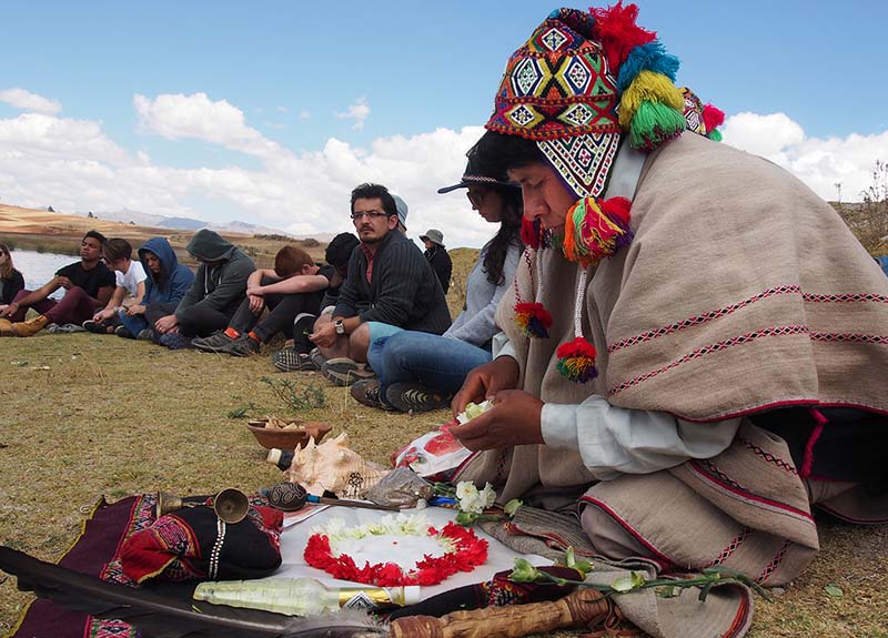 A Q'ero shaman prepares a Pachamama blessing